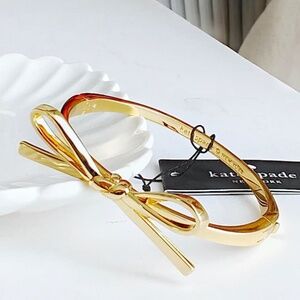 NWT Kate Spade Skinny Mini Bow Bangle Gold with dust bag K9250 $79